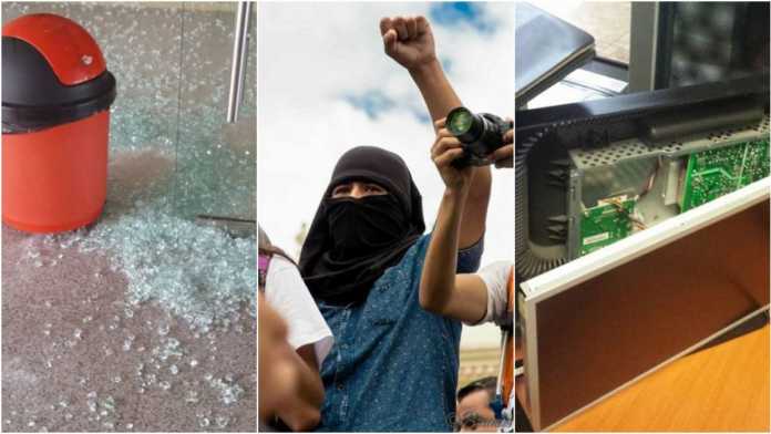 Supuestos estudiantes del MEU causaron daños al edificio administrativo de la UNAH.