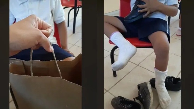 maestra le regala zapatos a su alumno